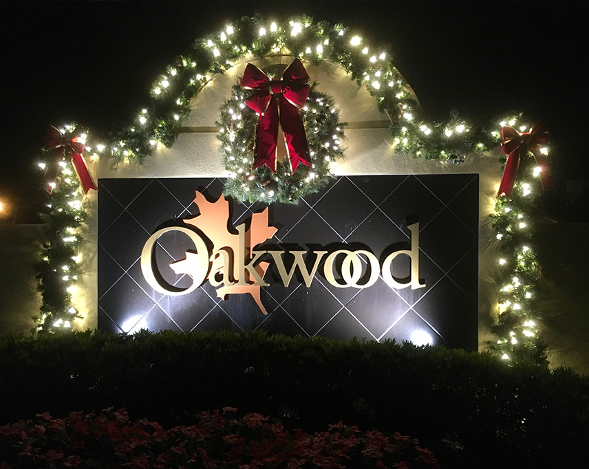 Oakwood Sign with Holiday Lighting | Naples Landscape Lighting